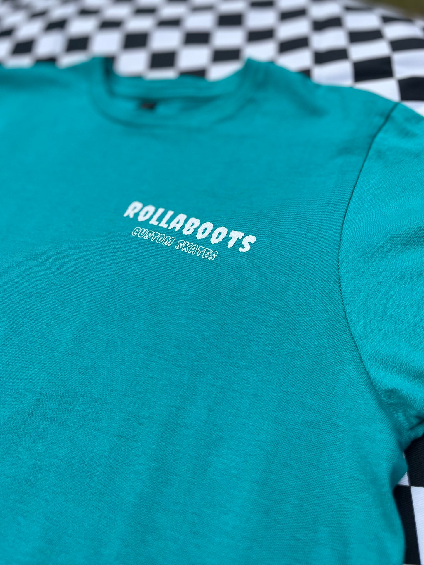 TURQUOISE ROLLABOOTS TEE